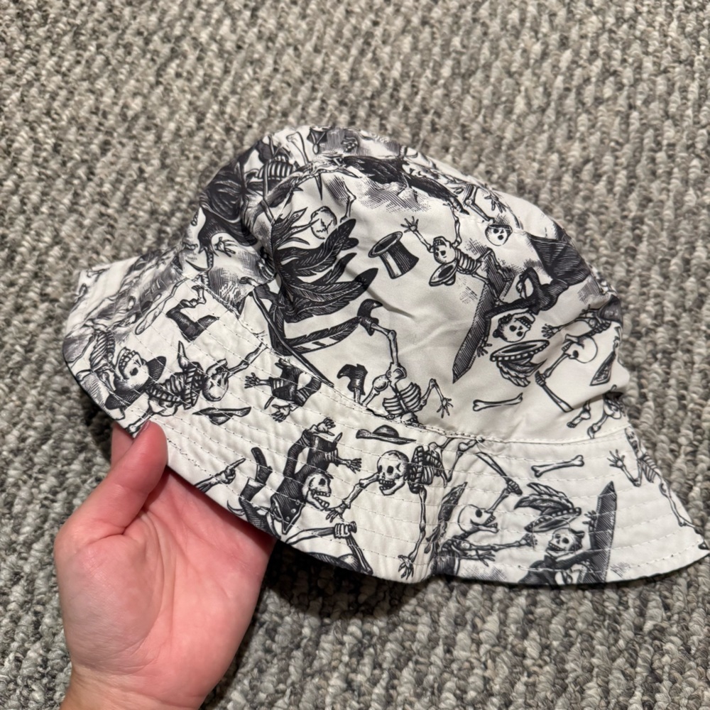 Espolòn Tequila reversible black and white bucket hat with a skeleton print